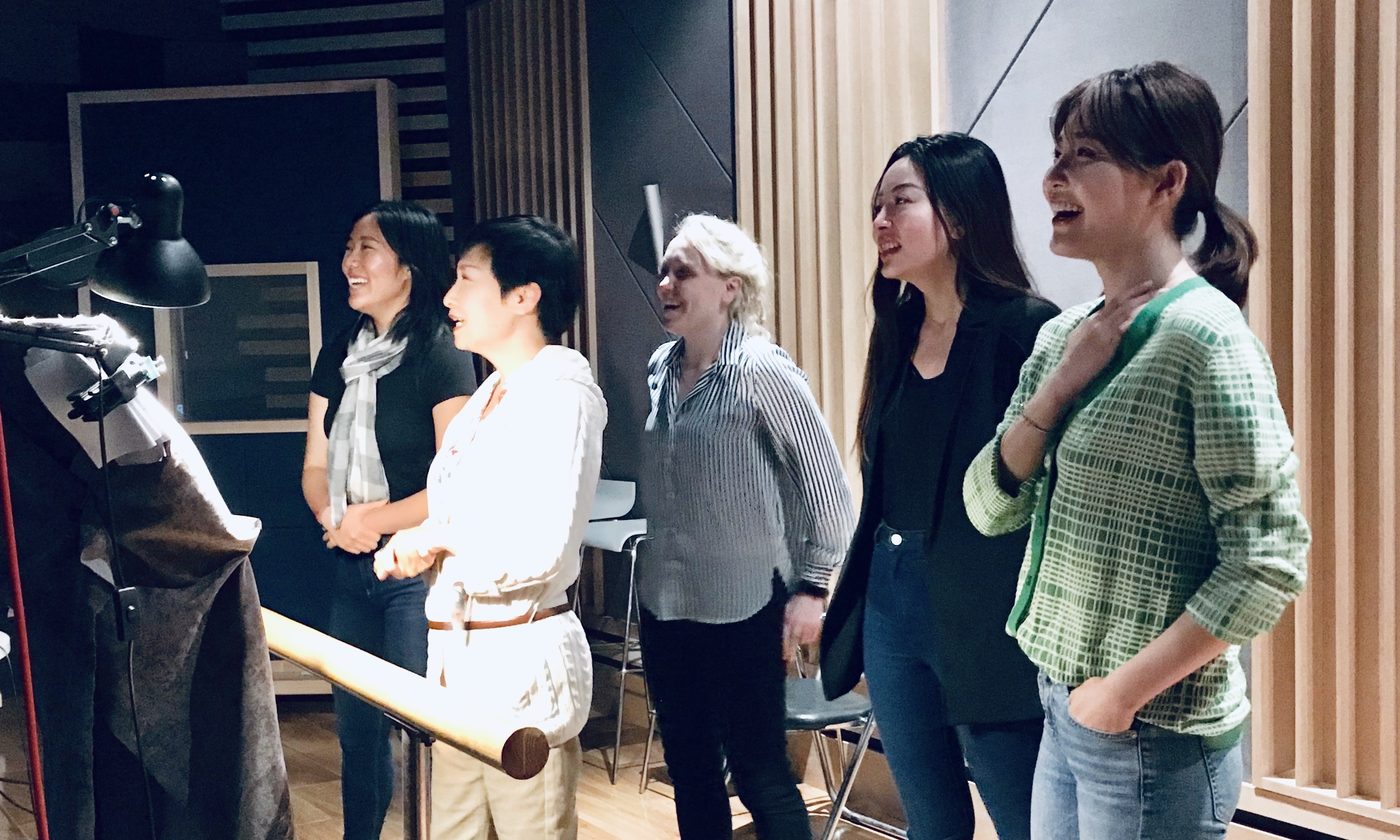 Actors recording at the microphone